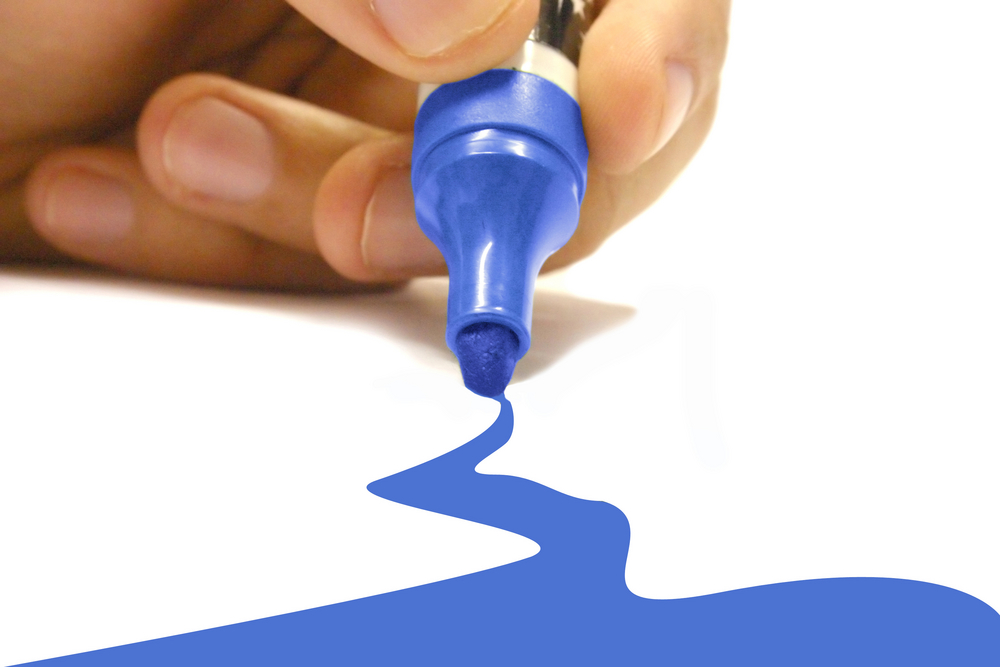 blue-marker-drawing-on-a-piece-of-paper