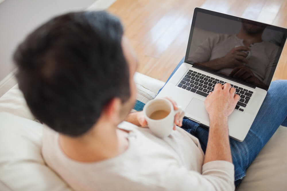 A man working on Laptop